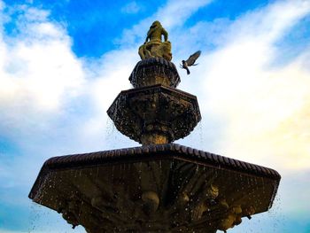 Low angle view of statue against sky