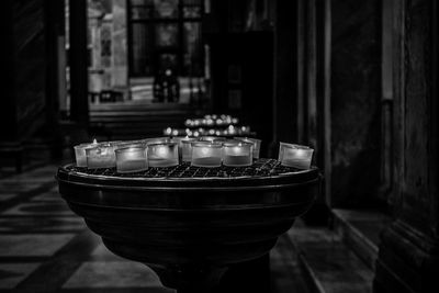 Illuminated tea lights on table