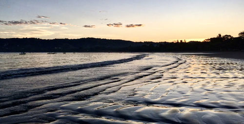 Scenic view of silhouette land against sky during sunset