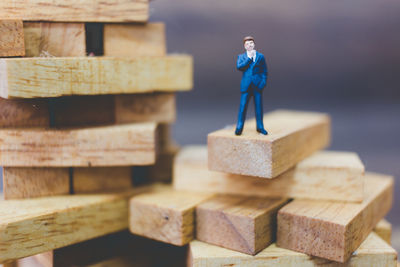 Close-up of figurine of stack of wood