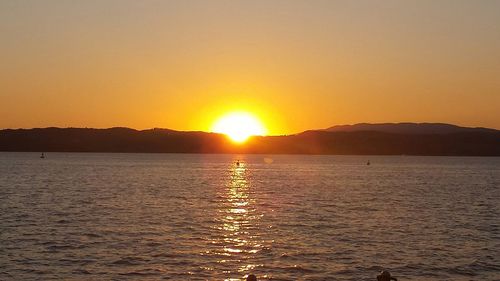 View of calm sea at sunset