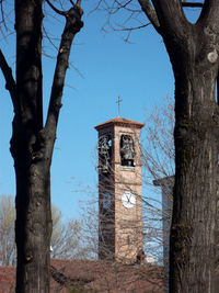 Low angle view of bell tower against sky