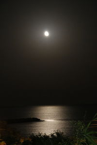 Scenic view of sea against sky at night