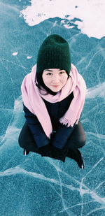 Portrait of young woman on a frozen lake 