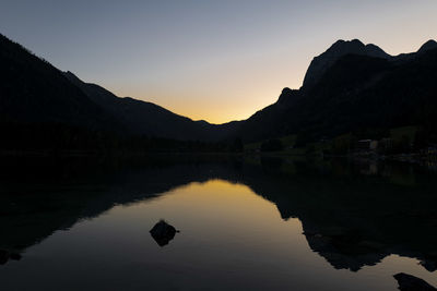 Moody, idyllic sunset at lake hintersee