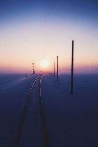 Silhouette of road during winter