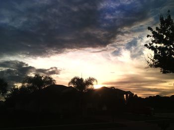 Silhouette of landscape against cloudy sky