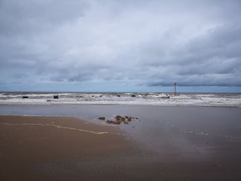 Scenic view of beach against sky