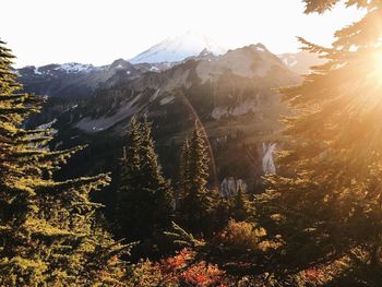 Scenic view of mountains against bright sky