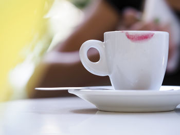 Close-up of coffee cup on table