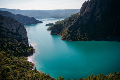 Panoramic view of sea and mountains against sky