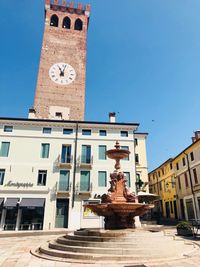 Statue of historic building against sky in city