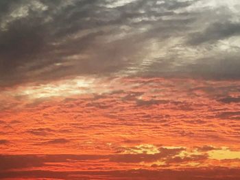 Low angle view of dramatic sky during sunset