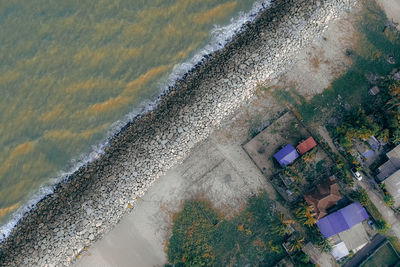 High angle view of houses by sea