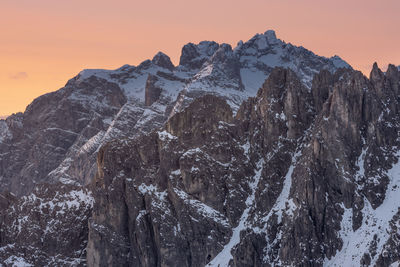 Panoramic view of snowcapped mountains against sky during sunset