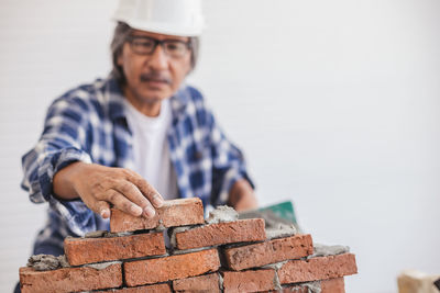 Portrait of man looking at construction site