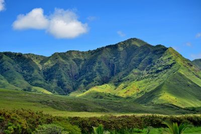 Scenic view of mountains against cloudy sky