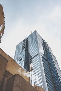 Low angle view of modern buildings against sky in city