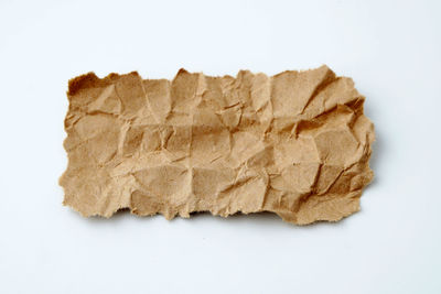 High angle view of bread against white background