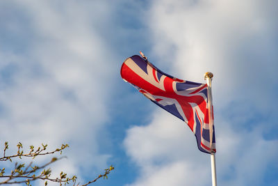 Low angle view of flag against sky