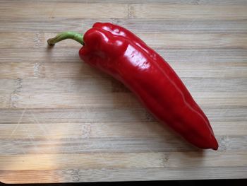 Close-up of red chili peppers on table