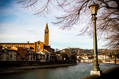 River amidst buildings against sky in city