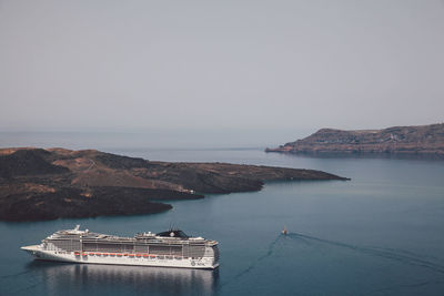 High angle view of cruise ship in sea against clear sky on sunny day