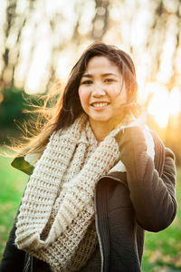 Portrait of a smiling young woman in park