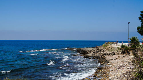 Scenic view of sea against clear sky