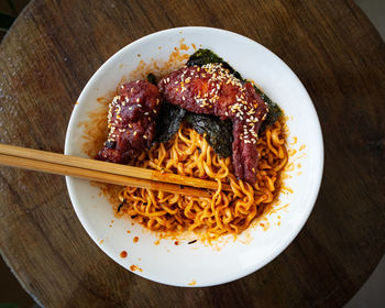 Korean hot spicy fried chicken served with ramen instant noodles, stir fried noodle.