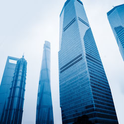 Low angle view of modern buildings against clear sky