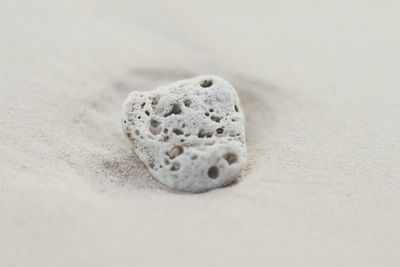 High angle view of pebbles on sand