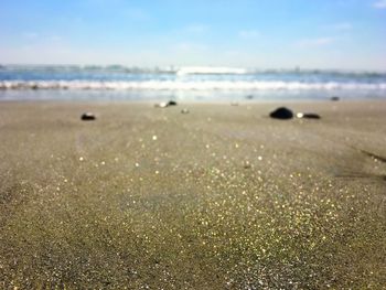 Surface level of beach against sky