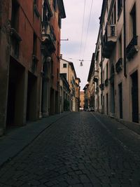 Narrow alley amidst buildings in city