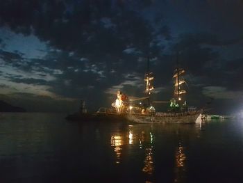 Scenic view of sea against sky at night