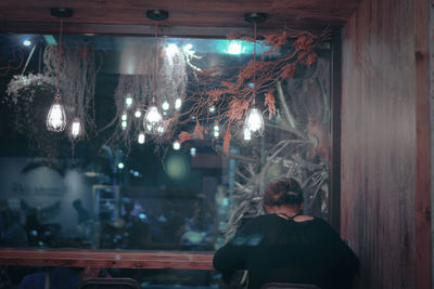 Rear view of people at night