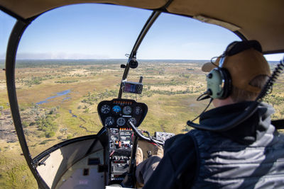 View from helicopter during flight over african steppe on sunny day