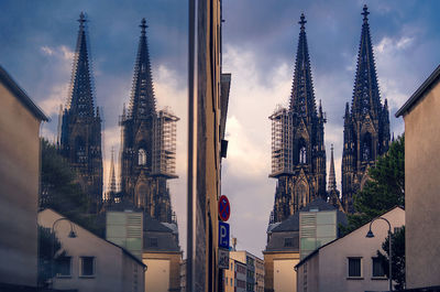 Panoramic view of buildings in city against sky