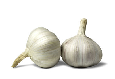 Close-up of garlic against white background