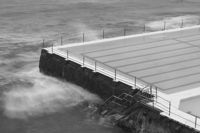 High angle view of swimming pool by sea