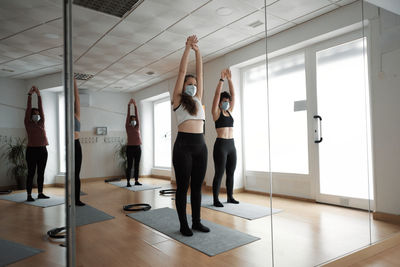 Group of women practicing pilates exercises in class