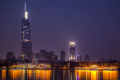 Illuminated buildings in city at night