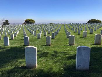 View of cemetery on field against sky