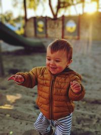 Cute boy standing outdoors