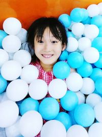 Portrait of cute girl amidst balloons