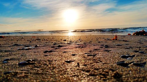 Scenic view of beach against sky during sunset