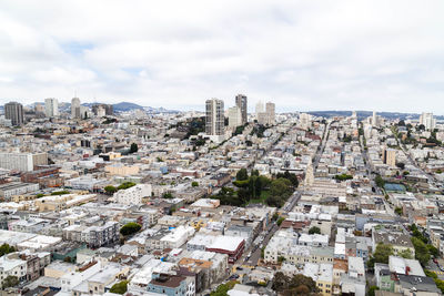 High angle view of buildings in city against sky