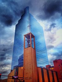 Low angle view of skyscraper against sky