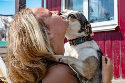 Side view of woman with dog