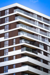 Low angle view of apartment building against sky